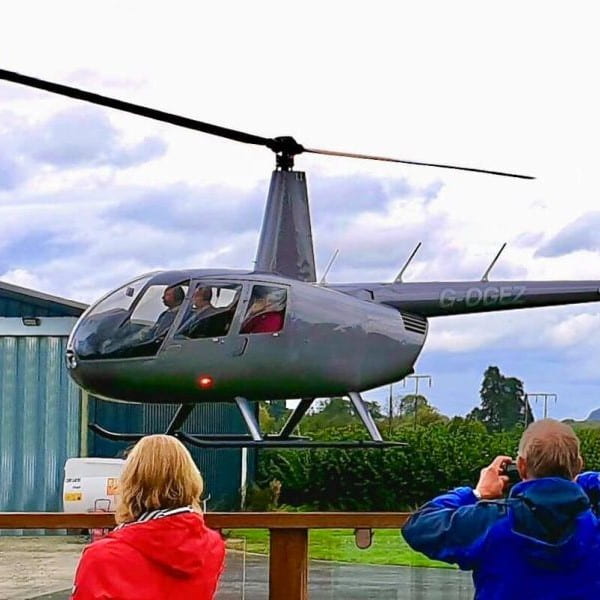 Whizzard Helicopters Robinson R44 in the hover-min