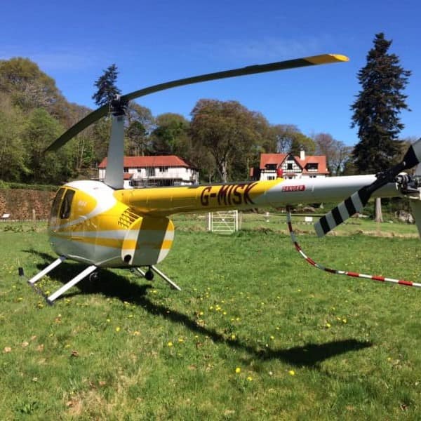 Whizzard Helicopters Yellow Robinson R44 parked-min
