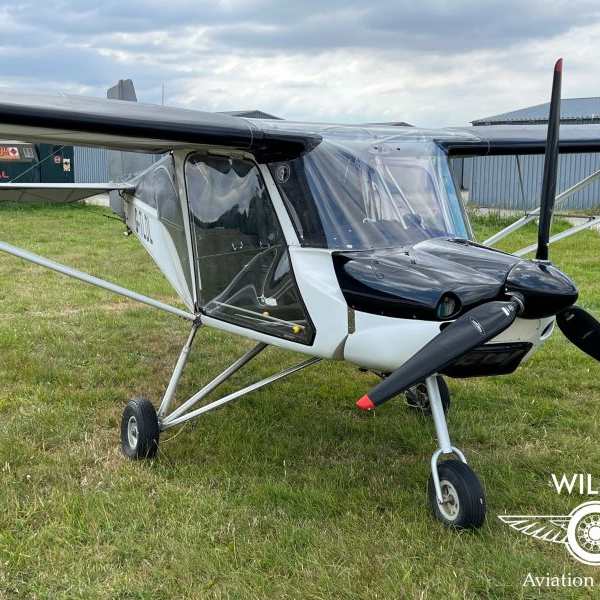 Wilco Aviation Limited stationary aircraft on grass front right