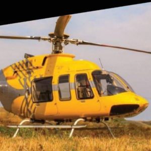 Yellow 1998 Bell 407 turbine helicopter for sale in South Africa by Aviation X. View from the right-min